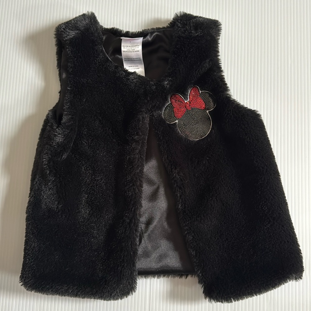 Disney Jr Black faux fur vest with black & red Minnie Mouse patch. Size 5